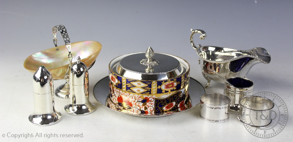 A selection of silver and plated wares, comprising; a silver mounted shell Birmingham 1911,