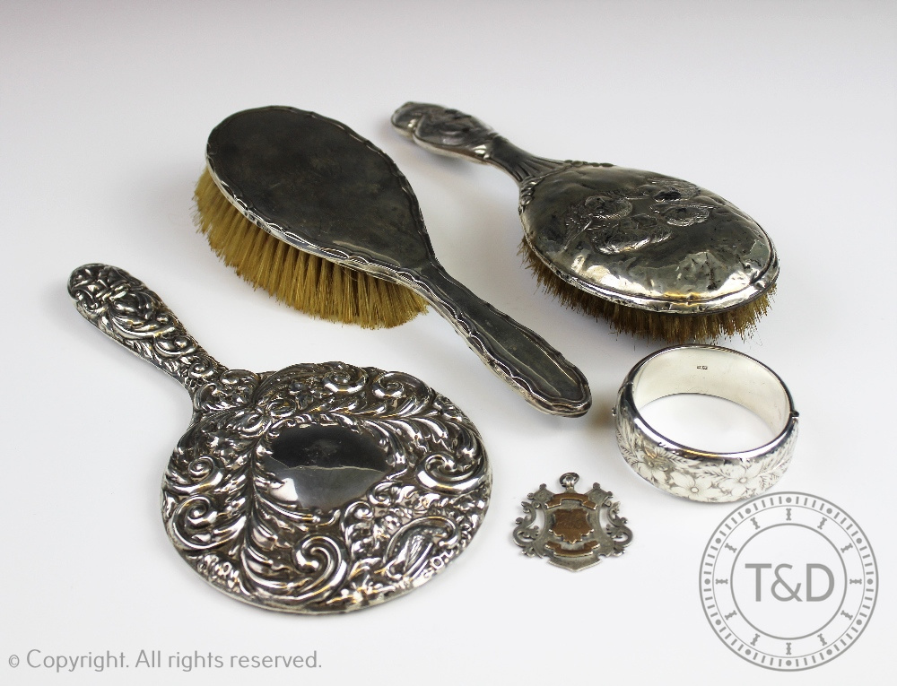 A selection of silver items comprising; a silver presentation fob, Birmingham 1899,