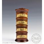 A 20th century walnut four section spice tower, for cloves, nutmeg, mace and ginger,