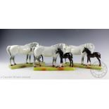 Three Beswick Mare and Foal groups, model number 1811, designed by Arthur Gredington,
