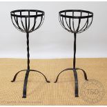 A pair of wrought iron plant stands,