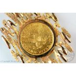 A United States of America gold $5 dollar piece dated 1899 set within a 9ct gold abstract surround