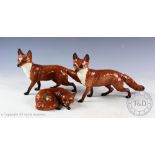 Three Beswick foxes comprising; 2x fox standing, model number 1016A, 13.