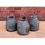 Three vintage copper milk churns,