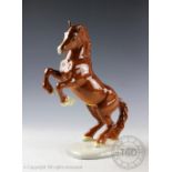 A Beswick Welsh cob (rearing), model number 1014, designed by Arthur Gredington, first version,