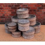 A collection of eight coopered oak and ash cheese / whey presses, largest 25cm H x 40cm diam,