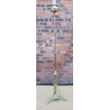 A late Victorian brass adjustable standard lamp, on foliate case tripod base,