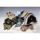 An assortment of textiles to include textiles panels, gloves, ostrich feathers,