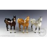 Three Beswick Swish tail horses, model number 1182, designed by Arthur Gredington, first version,