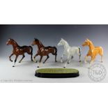 Four Beswick Spirit of the Wind horses, model number 2688, designed by Graham Tongue, facing right,