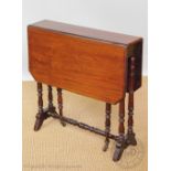 An Edwardian mahogany Sutherland table, on turned legs,