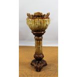 A late 19th century continental majolica type jardiniere on stand,
