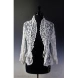 A white lace dressing jacket, possibly Carrickmacross, along with an ivory cotton shadow work fichu,