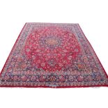A large Persian Mashad wool carpet,