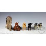 A collection of seven Beswick dogs, comprising; Yellow labrador, 8cm high, Rottwieler, 8cm high,