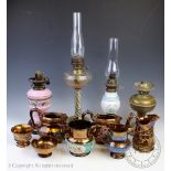 Four assorted 19th century and later oil lamps,