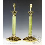 A pair of brass and onyx column table lamps,