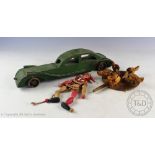 An early 20th century Folk Art green painted vehicle, 36cm long,