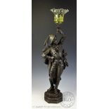A Victorian spelter gas lamp, modelled as a cavalier on canted base,