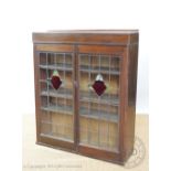 A late Victorian mahogany two door bookcase top, 111cm H x 100cm W,