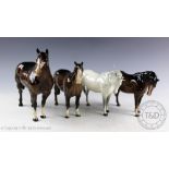 Two Beswick mares (facing right, head down), model number 1812, designed by Arthur Gredington,