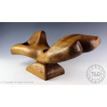 A Contemporary carved free form wooden sculpture, signed 'P.