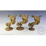 A set of three late Victorian cast brass wall lights,