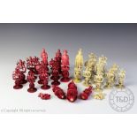 A 19th century Chinese and European carved and stained ivory export part chess set,