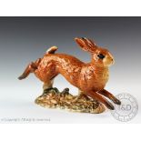 A Beswick Hare/running, model number 1024, designed by Arthur Gredington, issued 1945-1963, 12.