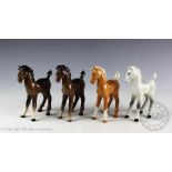 Four Beswick Foals (comical type), model number 728, designed by Arthur Gredington, Palomino,