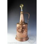 A large copper planished handled vessel, stamped, 58cm high,