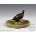 A cold painted bronze grouse, early 20th century, mounted on circular onyx base, 8.