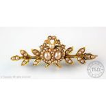 A Victorian or Edwardian seed pearl set entwined heart brooch,