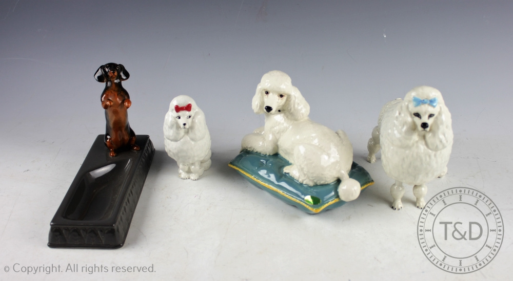 A collection of Beswick dogs, comprising: Poodle on Cushion, model number 2985 in gloss,