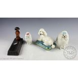 A collection of Beswick dogs, comprising: Poodle on Cushion, model number 2985 in gloss,