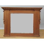 An Edwardian pine over mantle mirror, with carved detailing,