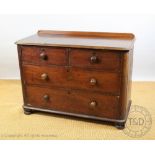 A Victorian mahogany chest, with two short and two long drawers, on plinth base,