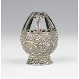 A white metal incense burner/holder,