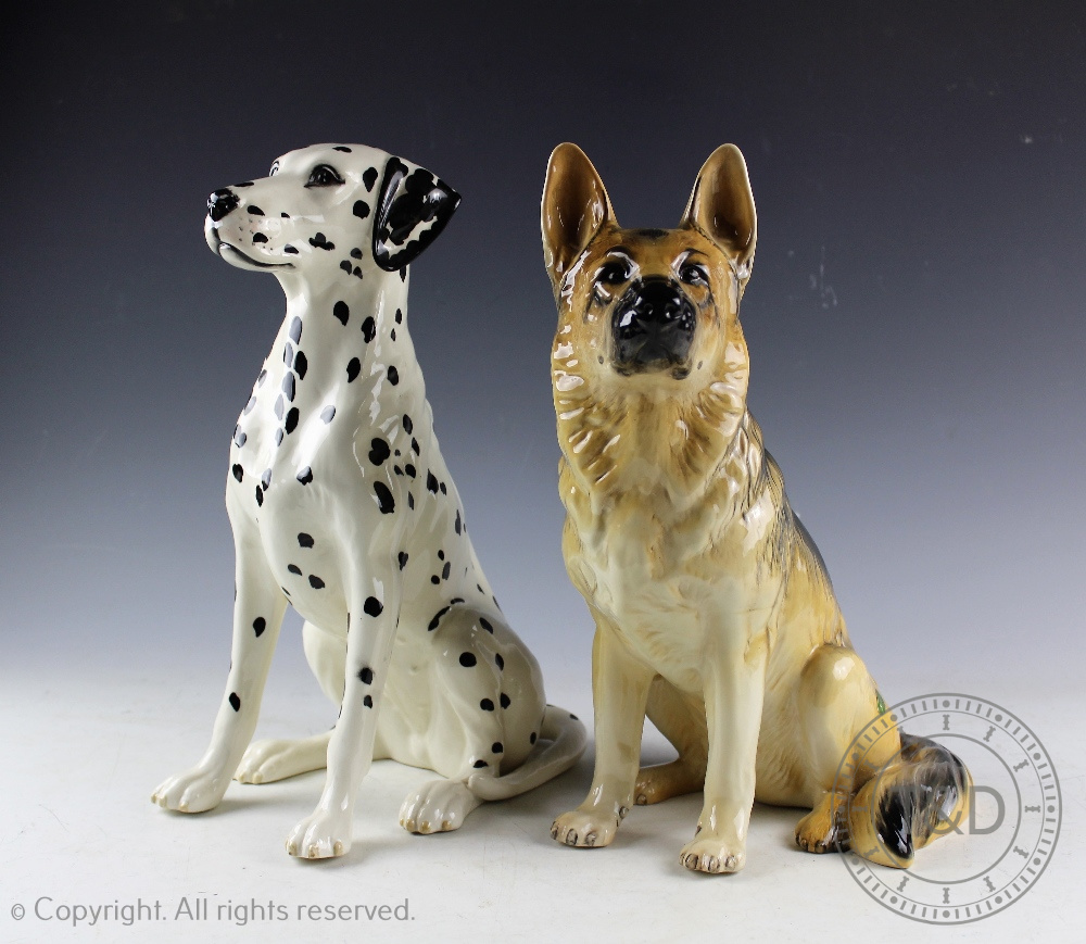 Two Beswick Fireside Model Series dogs designed by Graham Tongue, comprising; Alsatian 2410, 35.