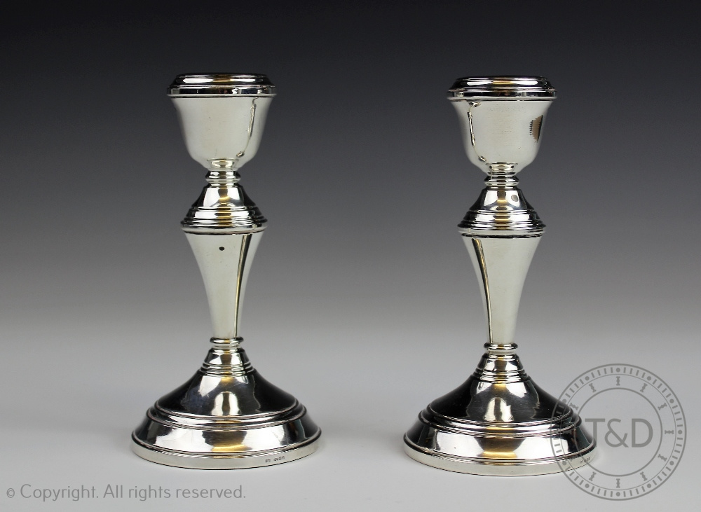 A pair of Irish silver candlesticks, Dublin 1976, with circular bases,