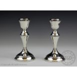 A pair of Irish silver candlesticks, Dublin 1976, with circular bases,