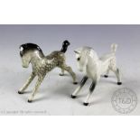 Two Beswick foals (small, stretched, facing right), model number 815, designed by Arthur Gredington,