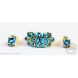 A blue topaz set dress ring with matched diamond and topaz earrings,
