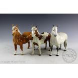 Three Beswick Pinto pony, model number 1373, designed by Arthur Gredington, first version, grey,