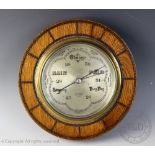 An early 20th century oak bulk head barometer, Reg No.