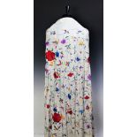 A large Chinese cream silk shawl with polychrome embroidery of peonies and butterflies together