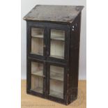 A Victorian painted pine vintage kitchen cabinet, with sloping top above four glazed doors,