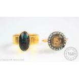 An Arts and Crafts turquoise matrix set 18ct yellow gold ring,