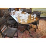 A George III style mahogany dining table, with one spare leaf,