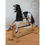 A Victorian style rocking horse, with painted features,